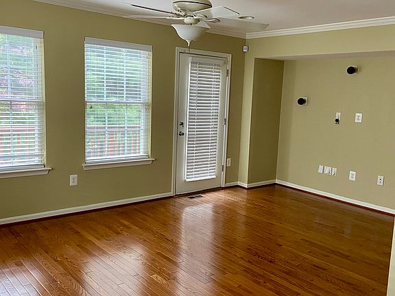 Upstairs living room with built in speakers and lot of natural light