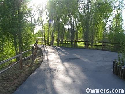 paved/split rail fence entry