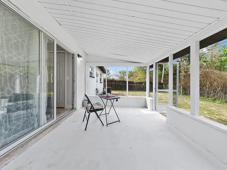 Private backyard through sliding glass doors read, relax, or take a call outside.