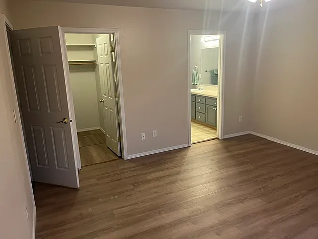 You can see the walk-in closet to your left and the generous master bath to your right.