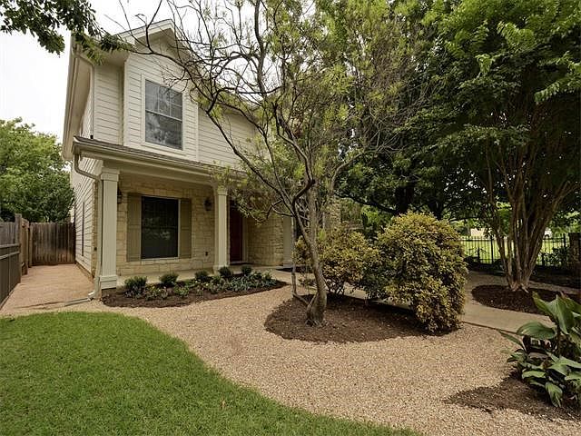 Charming front porch and attractive landscaping