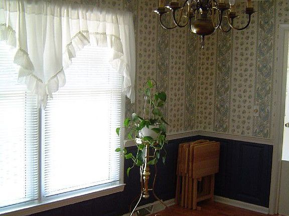 Dining room window looks out to fenced-in back yard.
