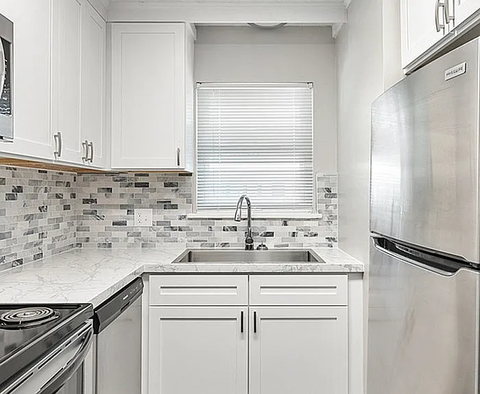 Experience culinary delight in this sleek kitchen, designed for modern living.