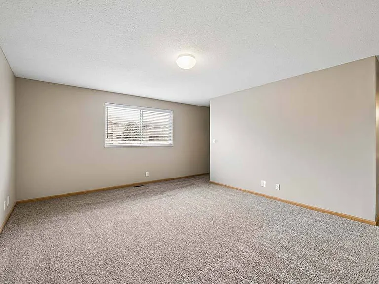 Designed with comfort in mind, this generously sized bedroom offers a quiet retreat with plenty of space to unwind, personalize, and truly feel at home.