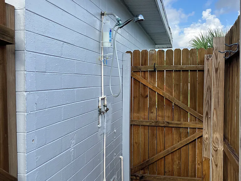Outdoor shower with hot and cold water - great to rinse off after beach time.