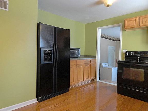 The kitchen is located just off the living room and is a spacious 19 ft. by 14 ft. and comes complete with newer appliances including a refrigerator, an electric oven/range, a microwave, and the sellers will leave a dishwasher they purchased that just hasn't been built in yet.