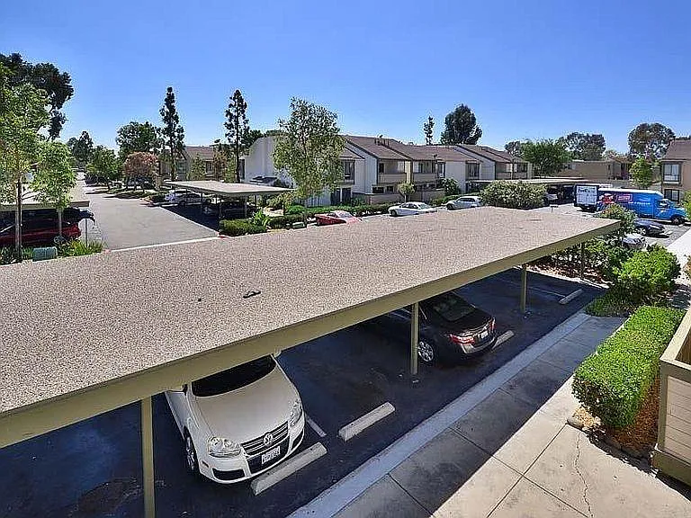 One covered and one open parking space. The open parking space is right outside the front door.