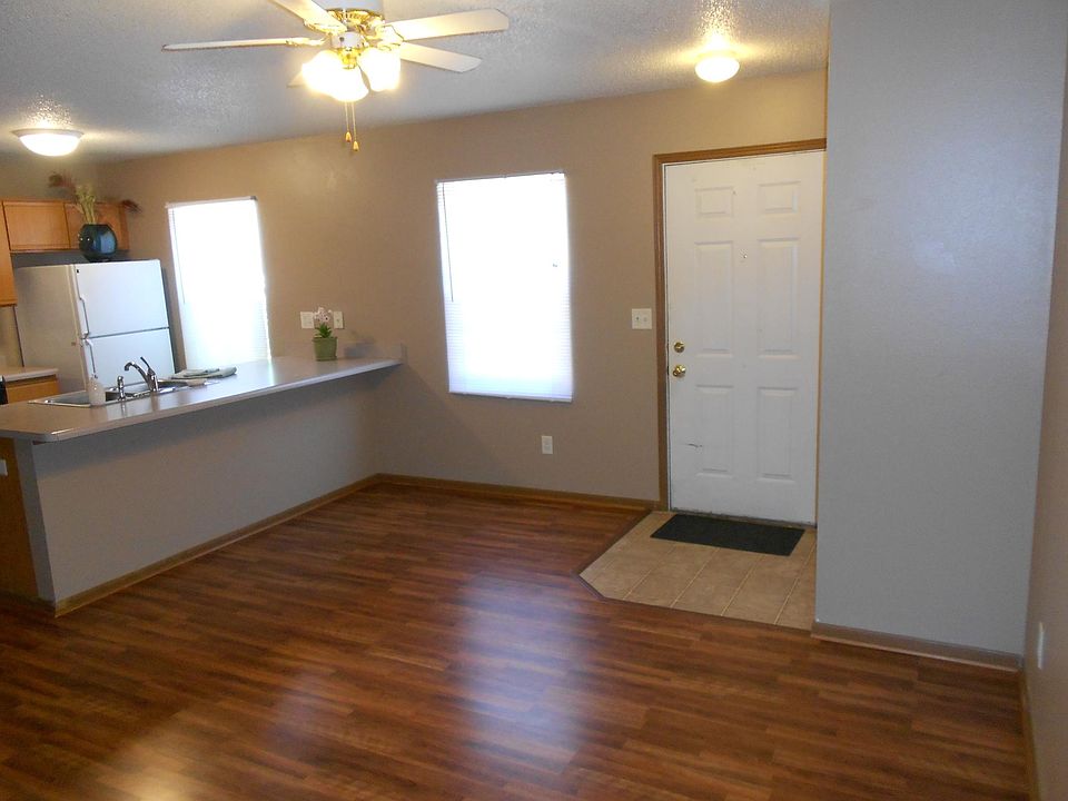 Living room viewing entry and kitchen