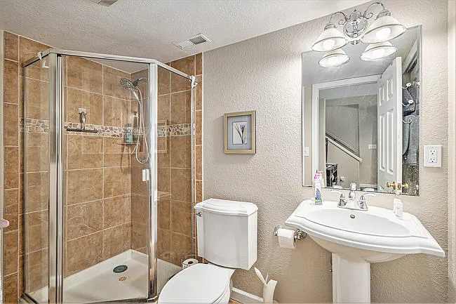 basement bathroom with 3/4 shower