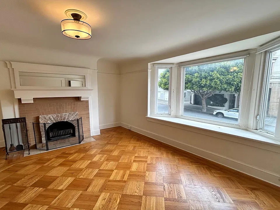 Bedroom -- fireplace, bay window view