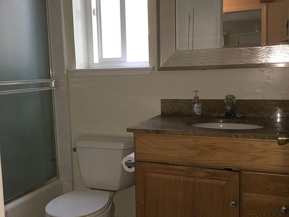 updated bath in hallway.  there is a 1/2 bath in the master 