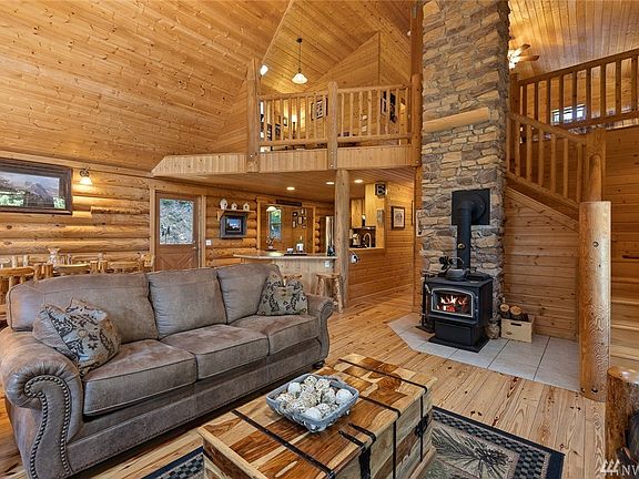 Living space looking back towards the dining/kitchen area, & up towards the loft & Master Suite.
