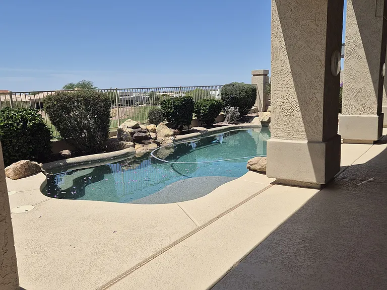 Backyard with magnificent views of Red Mountain golf course and city lights at night.