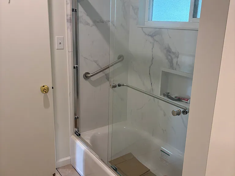 Bathroom w/ New Shower Surround , new Bath Tub w/Niche, new grab bar , New Shower doors, new Shower/tub valve