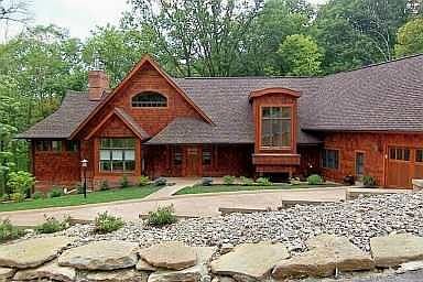Absolutely splendid cedar & br w private, scenic, wooded setting. 5650 sqf.