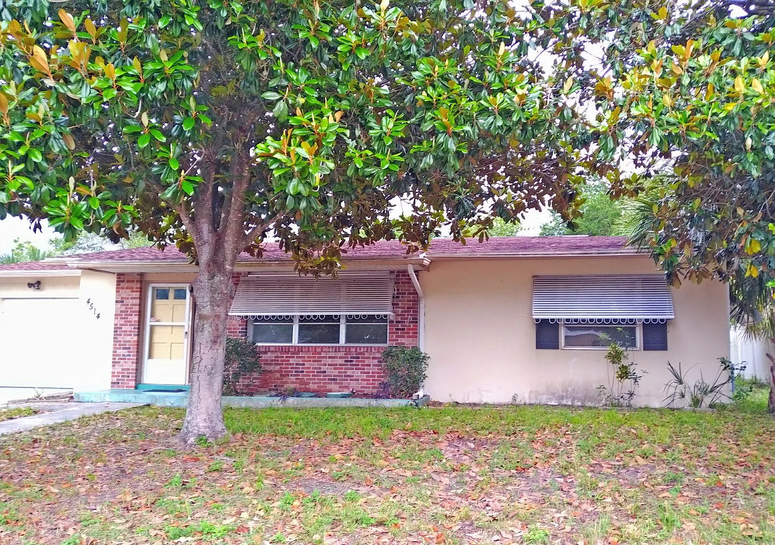 Spacious 2/2 home featuring neutral ceramic tile throughout within the heart of Spring Hill — Photo 1