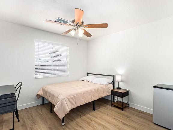 Full size bed, desk, mini fridge and full size closet