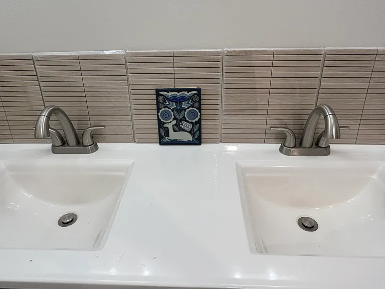 double vanity and about-to-be-installed backsplash