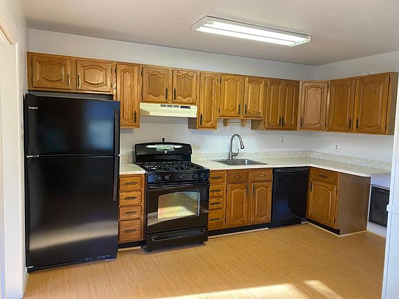 Kitchen with brand new refrigerator and dishwasher. Gas range.