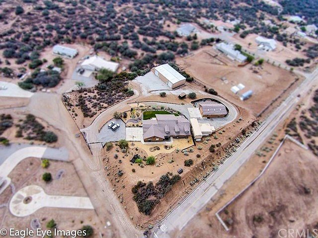 Property is located on the Corner of Lantry and Coleridge. You see the house in the foreground, the RV Carport to the right, the carport to the right of that. The Detached Building to the right of the house is the 1,400 sq ft oversized RV Garage/Workshop 