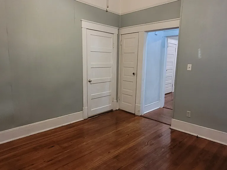 This large room with closet, adjacent to the kitchen, can be utilized as the Living room or as a large bedroom.