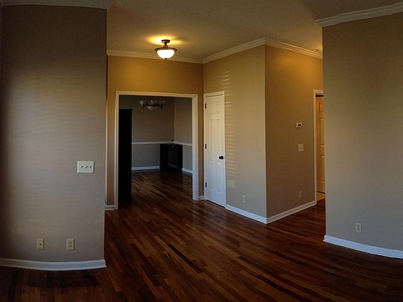 Front, formal living room. First floor has 8' ceilings and crown moulding