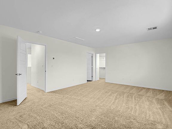 This massive master bedroom features its own full bathroom