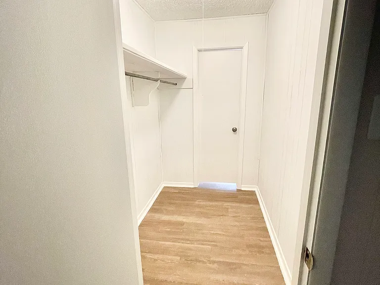 Large walk-in closet in front room with french doors