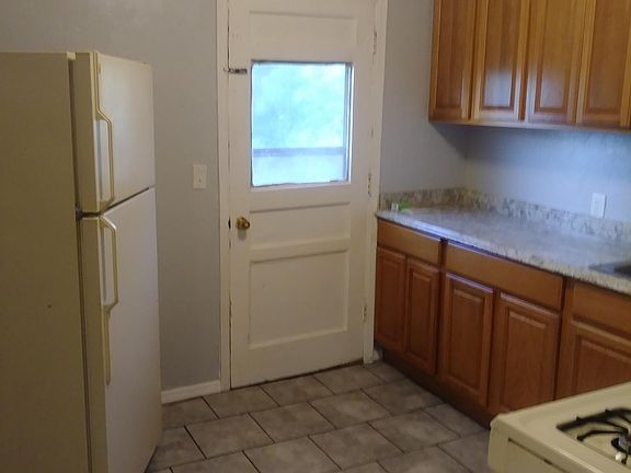 kitchen with frig and stove.
