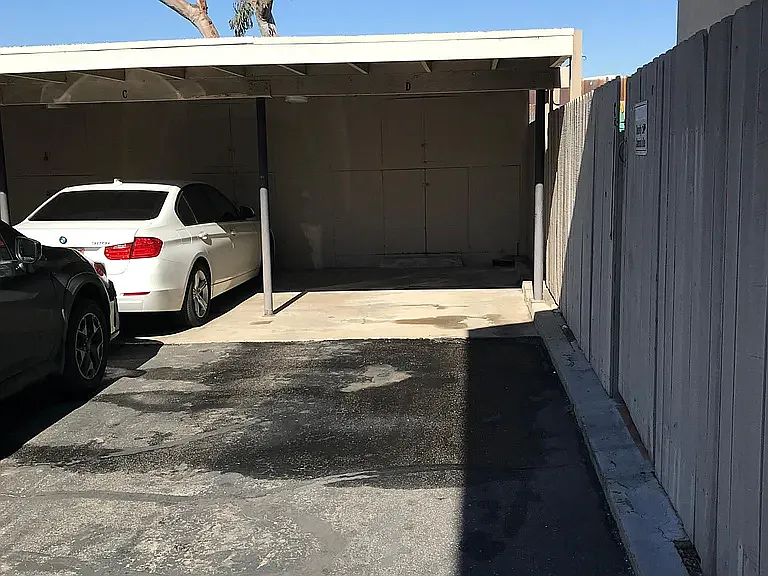 Two assigned parking spaces; one covered, one directly behind it