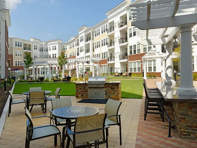 Courtyard with barbecue grill and dining area