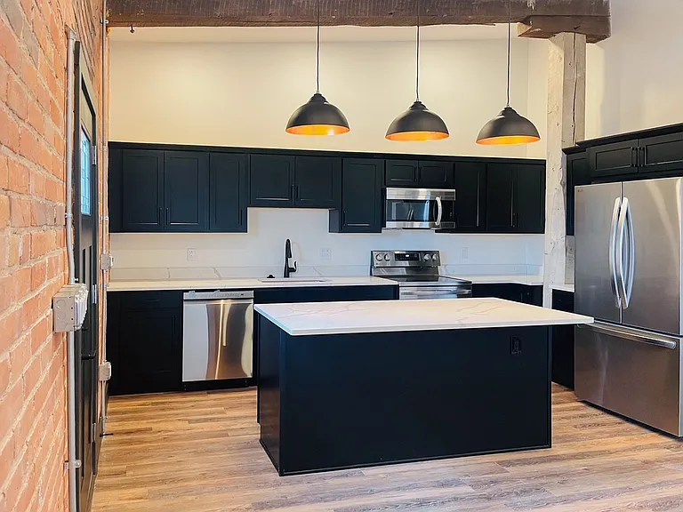 Kitchen is fully equipped with stainless steel appliances.