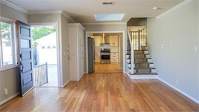Entry and view from living room to kitchen