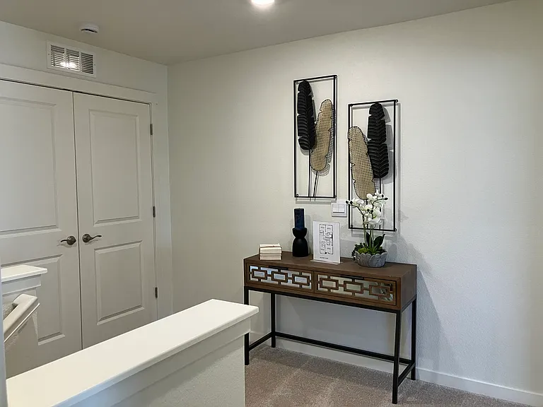 Sample of same floor plan, different finishes, staged with furniture.