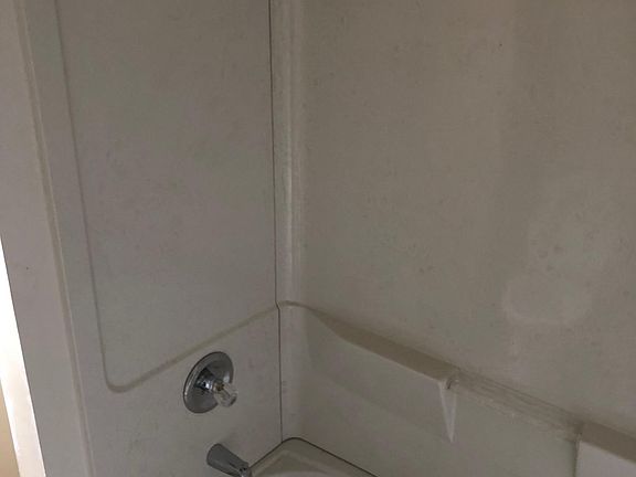 two new showers and tubs
