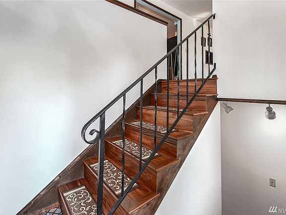 Hardwood stair to access main and lower level.