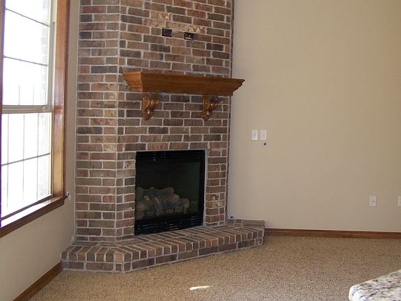 From dining to living.  Fireplace has permanent logs and natural gas