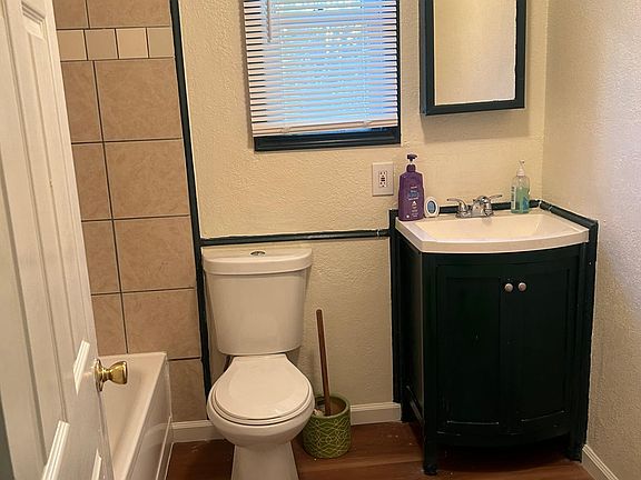Bathroom with tub and shower
