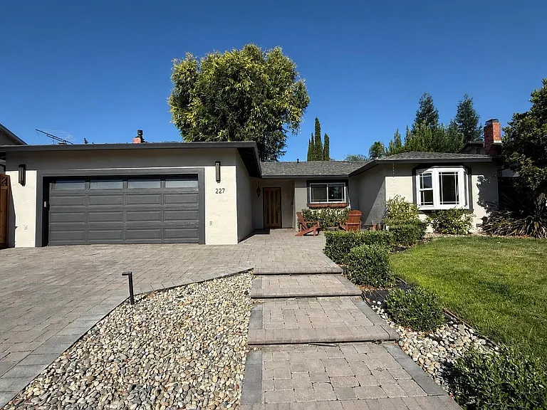 Front of House with landscape lighting