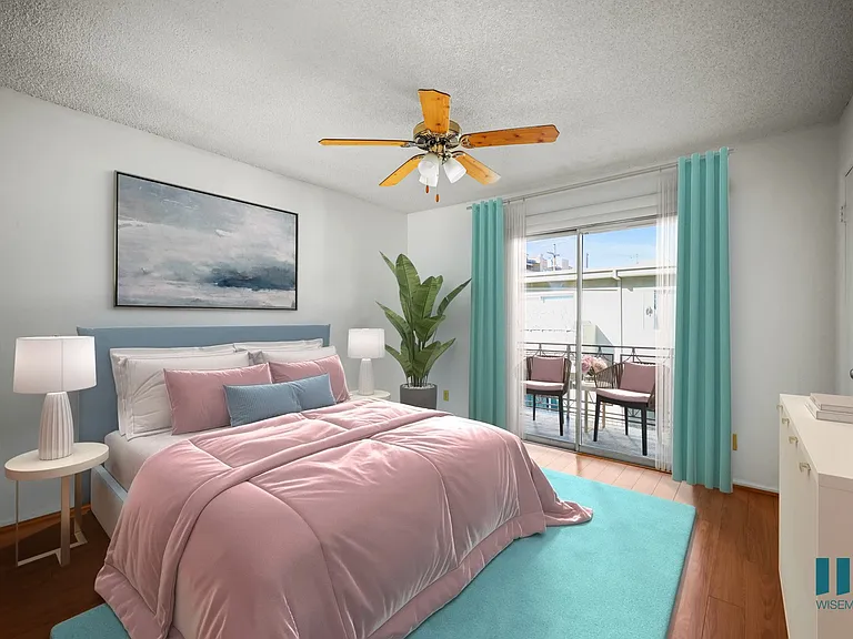 Bedroom with Mirrored Closet, Vinyl Flooring, Ceiling Fan, and Windows