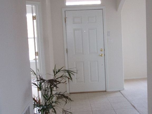 Entry foyer with office/den and formal dining room to sides