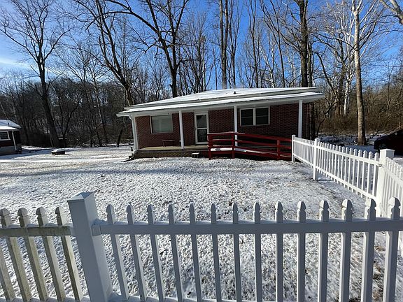 Fence encloses much of the front and side yard