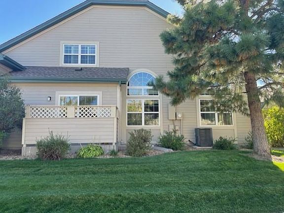 Side of unit with outdoor patio and gate, sliding door off kitchen