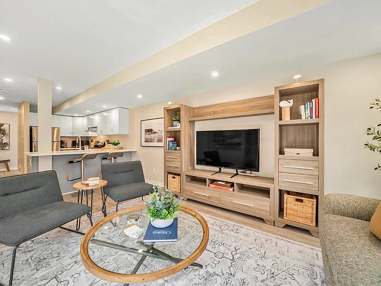 Comfortable living room with 49" Smart TV in an Ottawa rental.