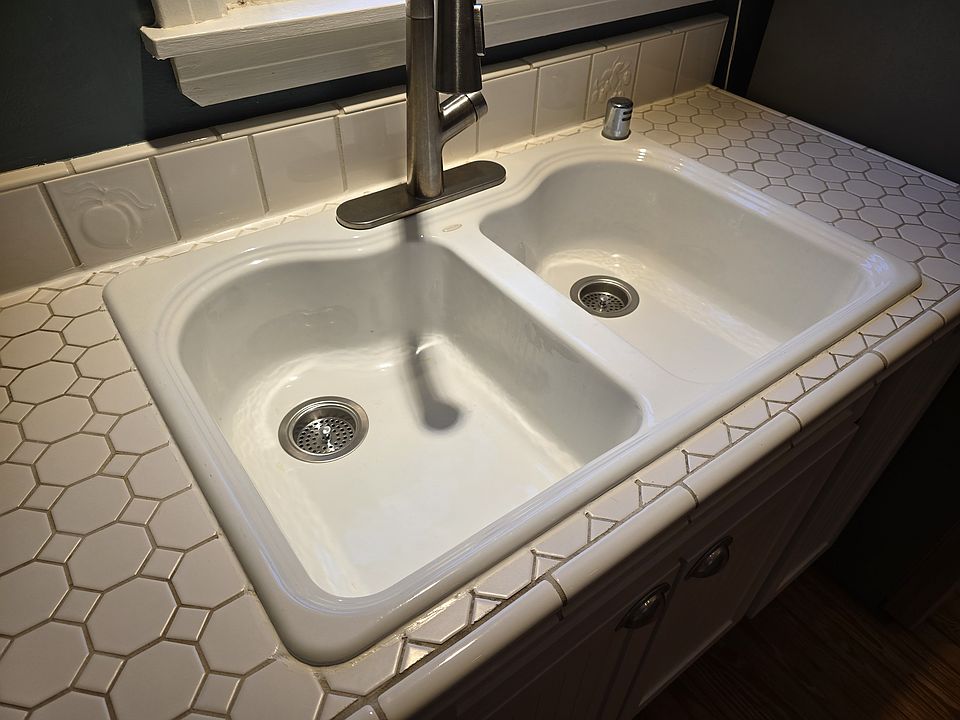 Cast iron double bowl sink. Hansgrohe kitchen faucet.