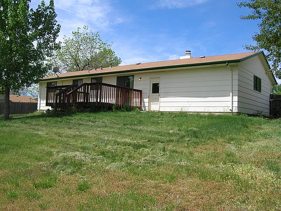Back of house with large deck. House has been painted since this picture was taken.
