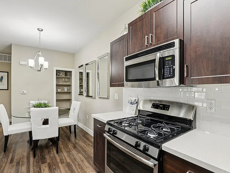 Wood Cabinets, White Quartz Countertops, Shelved Closet