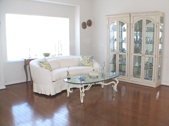 Sun Filled Formal Living room with wood floors 