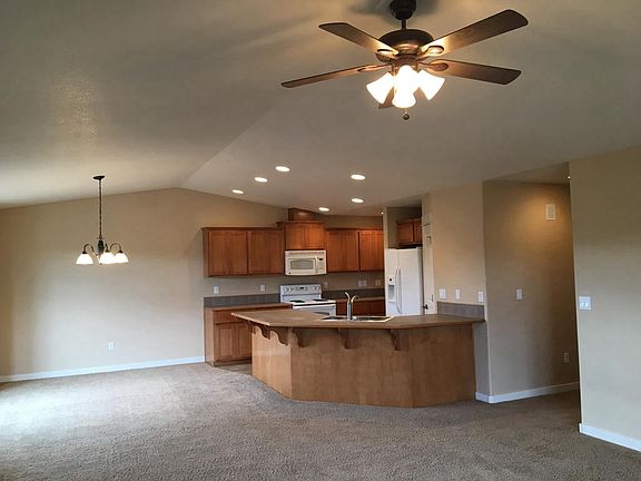 View from great room into kitchen and dining room.