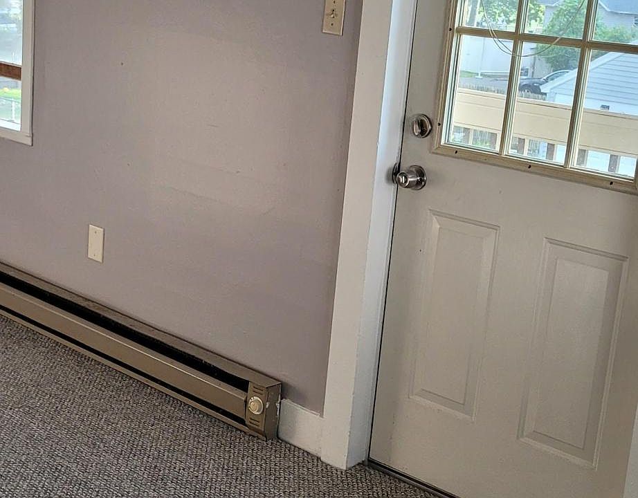 What's considered the back door, but is the main entrance to the apartment